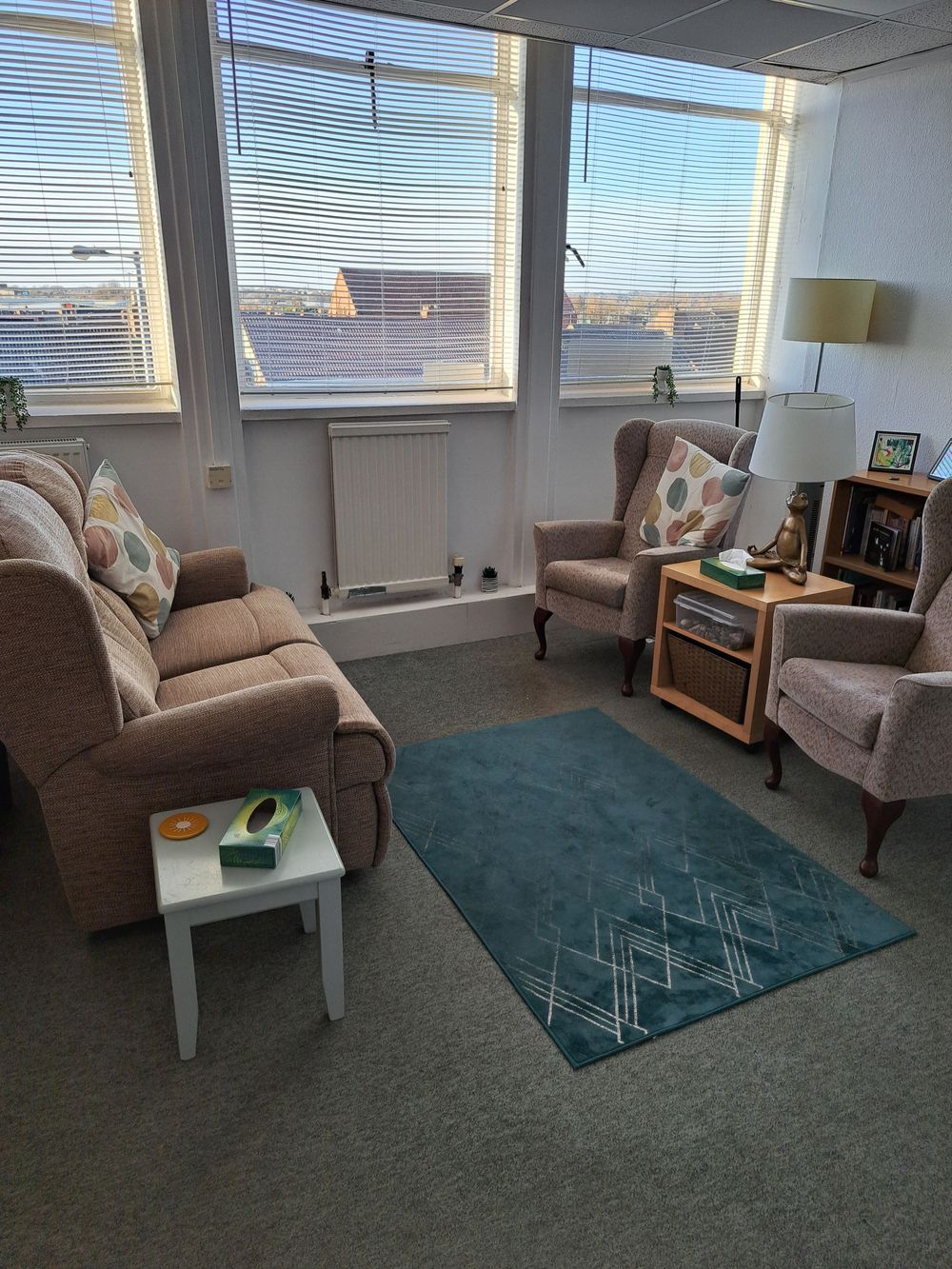 Large bright comfortable space with seating options and plenty of natural light.