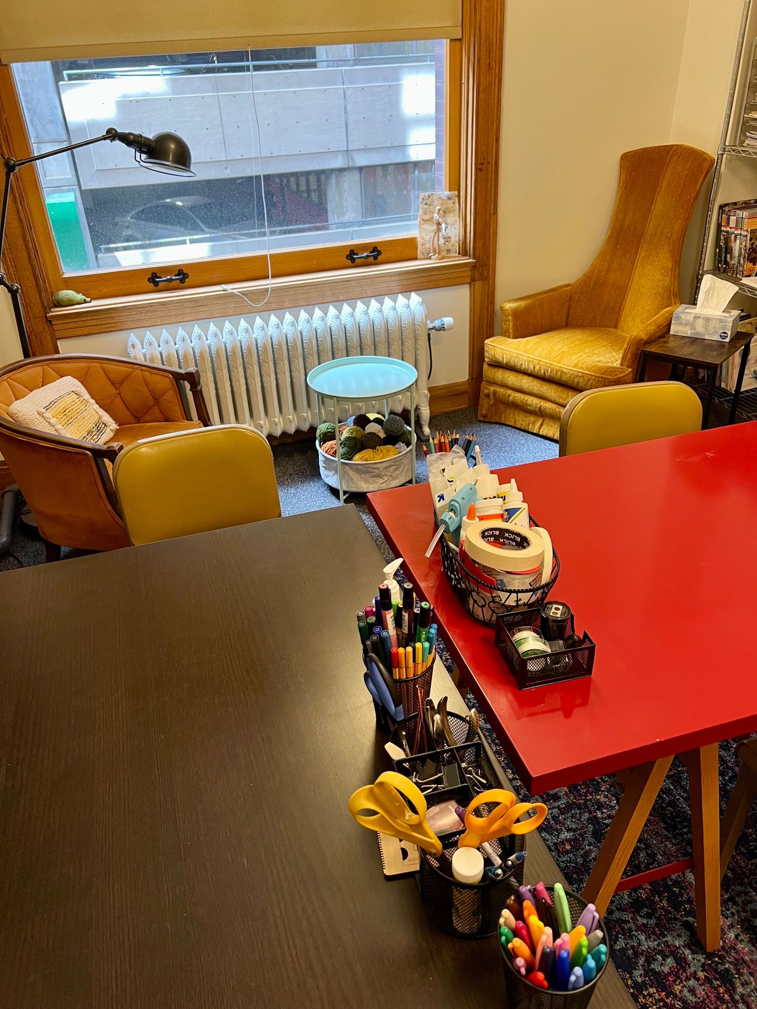 Gallery Photo of My office/studio includes an option of sitting at tables for artmaking or sitting in comfy chairs.