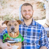 Gallery Photo of Brett with Harley, his certified therapy dog