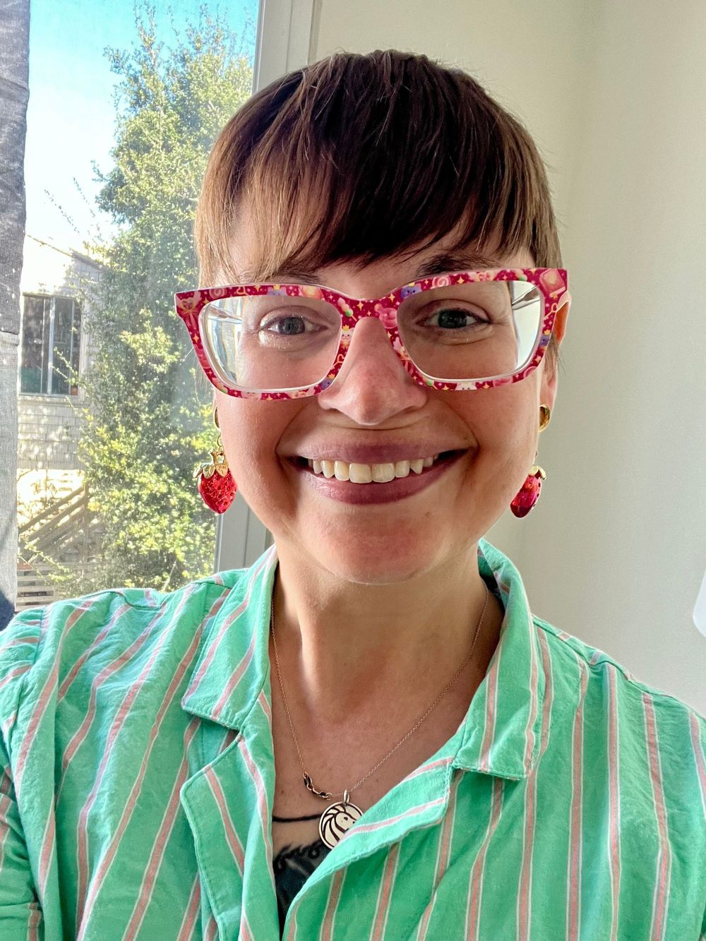 The face behind the profile: a queer, neurodivergent, meds-aware therapist who absolutely wants to meet your pets.