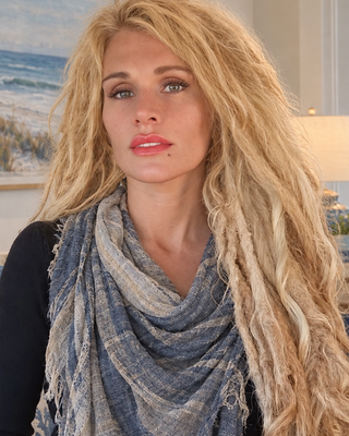 Photo of Dr. Cheri Hausmann, Marriage & Family Therapist, PhD, LMFT, E-RYT